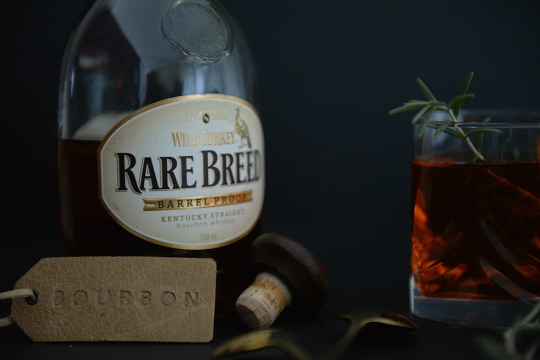 Vintage wine bottle with cork on dark background